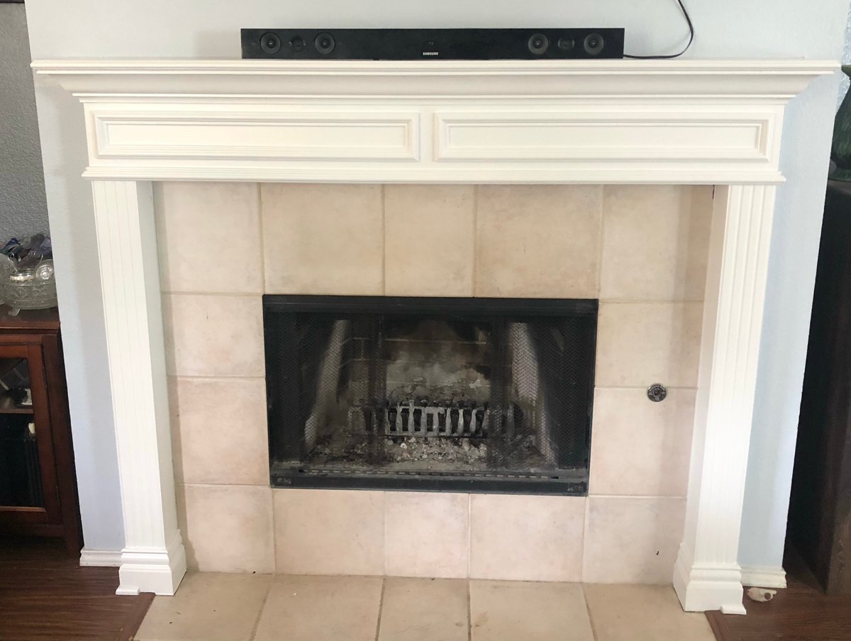 Fireplace mantel and trim painted white