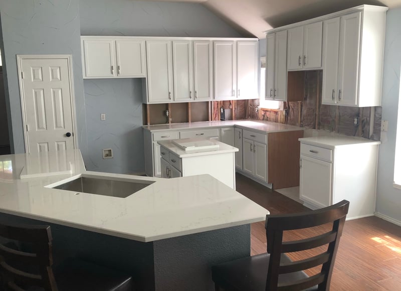 White painted kitchen cabinets and island