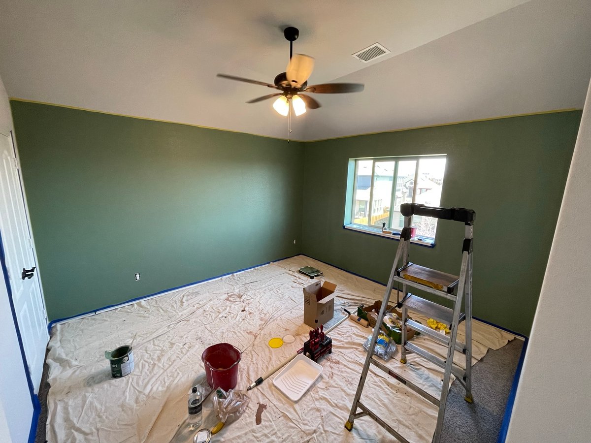 Bedroom with sage green accent walls